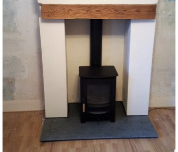 Charnwood C6 Log Burner - fitted by our installers with a Green Slate hearth in Bramley near Guildford, Surrey.